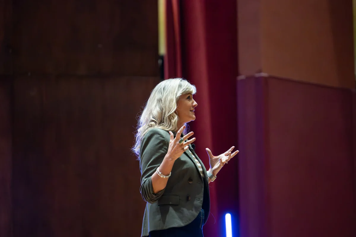 Laura Parker speaking on stage at the Digital Safety Summit in Denver, Colorado